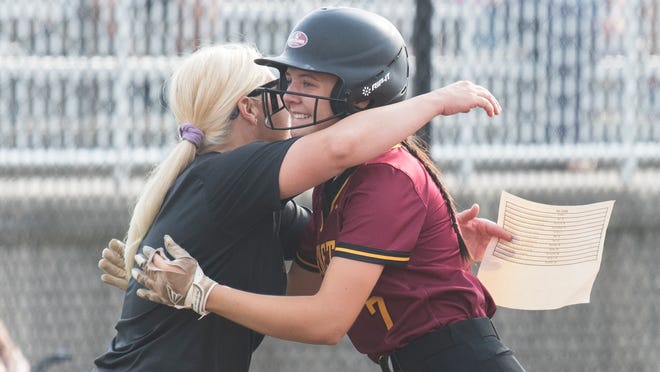Haddon Heights’ Kylee Helmetag, right, is congratulated by Haddon Heights head softball coach Michelle Schlichtig-Hastings after Helmetag hit a grounder that led to three runs being scored during the state Group 2 semifinal softball game between Haddon Heights and Bordentown played at Bordentown High School on Wednesday, June 1, 2022.  Haddon Heights defeated Bordentown, 3-0.