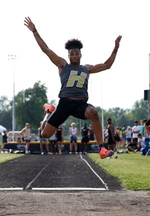 Holt's Kellen Reed jumps in the long jump, Tuesday, May 31, 2022, during the Honor Roll Track Meet at Waverly High School.