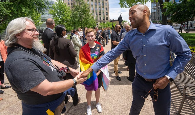 Lt. Gov. Mandela Barnes, right, greets people at the Rainbow Pride flag raising Wednesday, June 1, 2022 at the Capitol in Madison, Wis.