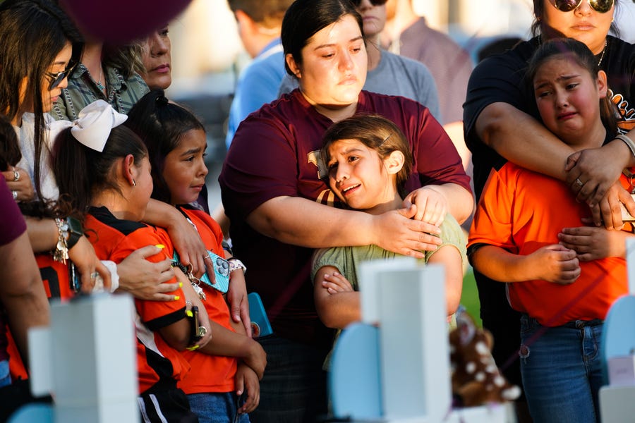 Mourners pay their respects on May 27, 2022, at a memorial for the children and teachers killed at Robb Elementary School in Uvalde, Texas, on May 24, 2022.
