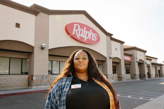 Ashley Manning poses for a portrait in front of her workplace in San Pedro, Calif., in April 2022.