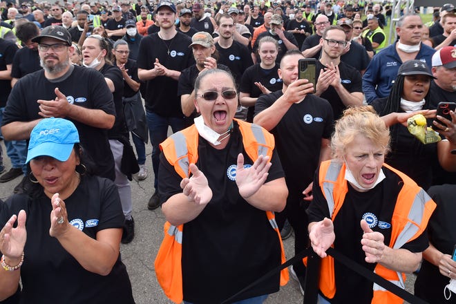 Workers of the Ford Motor Co. cheer during a news conference, Thursday, June 2, 2022, in Avon Lake, Ohio. Ford announced it will add 6,200 factory jobs in Michigan, Missouri and Ohio as it prepares to build more electric vehicles and roll out two redesigned combustion-engine models. (AP Photo/David Richard)