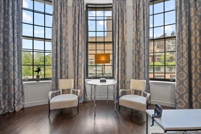 Bow windows illuminate the great room space and brings in wonderful Charles River views.
