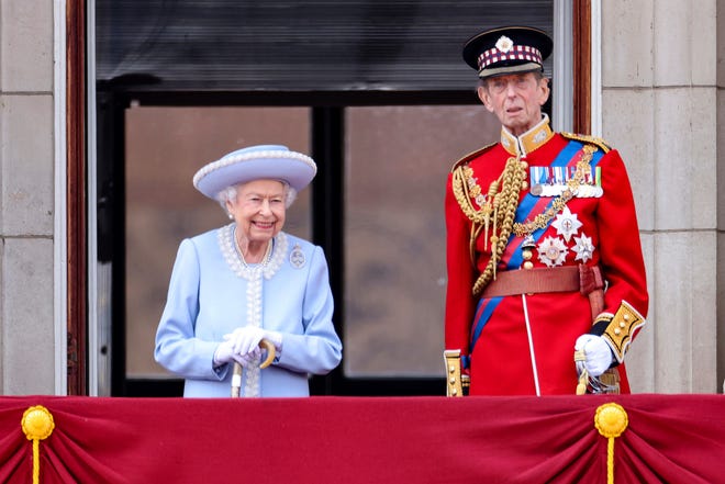 Queen Elizabeth II and the Duke of Kent watch from the balcony of Buckingham Place after the Trooping the Color ceremony in London, Thursday, June 2, 2022, on the first of four days of celebrations to mark the Platinum Jubilee.
