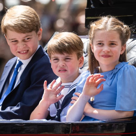 Prince George, Prince Louis and Princess Charlotte of Cambridge ride in an open carriage with their mother, Duchess Kate of Cambridge, and their step-grandmother, Duchess Camilla of Cornwall, during the Trooping the Colour parade kicking off the queen's Platinum Jubilee marking 70 years on her throne.