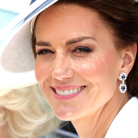 Duchess Kate of Cambridge rides in a carriage duri