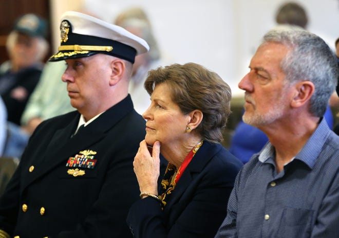 Capt. Michael Oberdorf, commander of Portsmouth Naval Shipyard, left, Sen. Jeanne Shaheen and Martin Riordan listen to Ray Dito, Marine and retired fire captain, shares stories about George Riordan, who was posthumously awarded a Bronze Star Friday, June 3, 2022.
