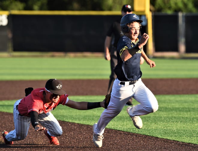 Argyle second baseman Colton Roquemore, left, tags out Stephenville's Mason Weyers, who was picked off at second and caught in a rundown with one out in the second inning.