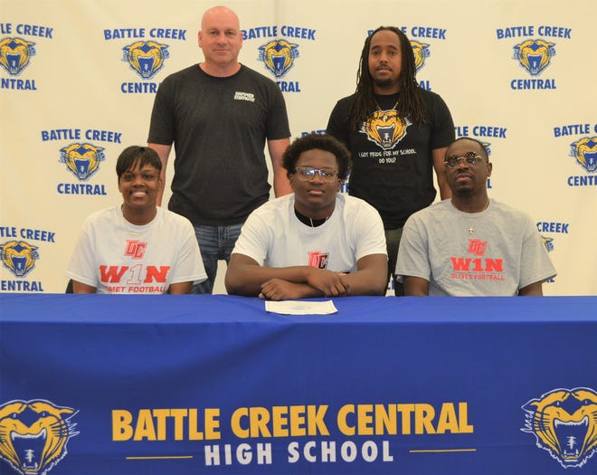 Joined by his parents and coaches, Battle Creek Central senior Javeon Underwood committed to play college football at Olivet College during a signing ceremony at BCC High School.