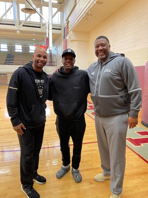 Thomas Kelley, left, stands with Cassius Winston, center, and WMU head coach Dwayne Stephens during a recent recruiting trip to Detroit Jesuit High School (where Winston once played) during a recruiting trip.