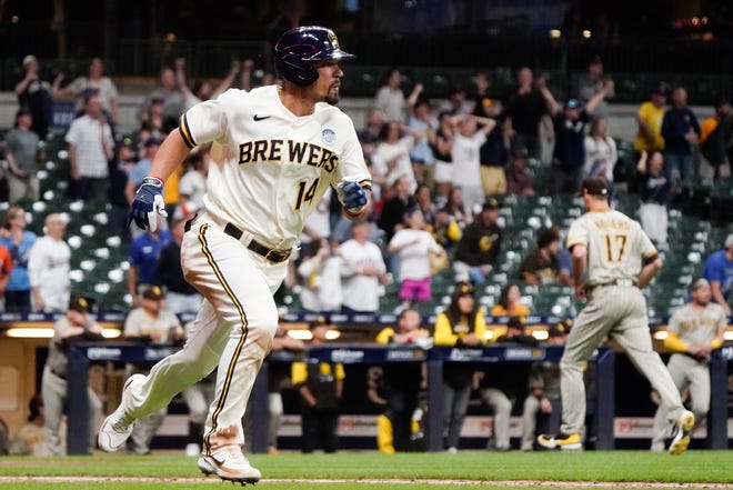 Milwaukee Brewers' Jace Peterson hits a three-run scoring triple during the ninth inning of a baseball game against the San Diego Padres Thursday, June 2, 2022, in Milwaukee. (AP Photo/Morry Gash) ORG XMIT: WIMG135