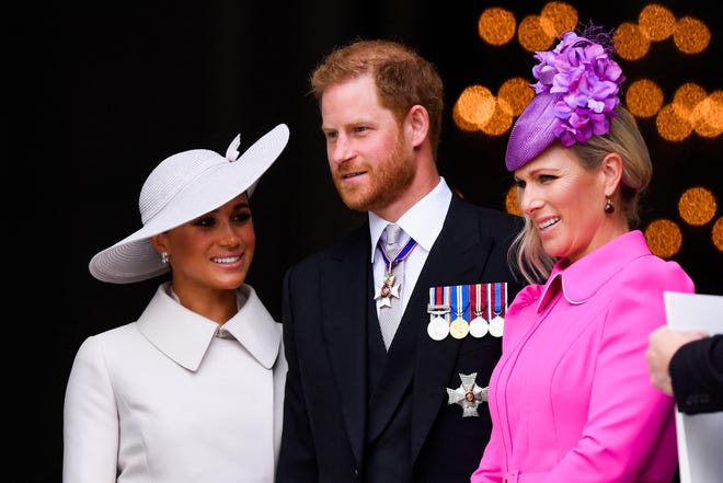 Prince Harry, Duke of Sussex, Meghan, Duchess of Sussex, and Zara Tindall leave after attending the National Service of Thanksgiving at St Paul's Cathedral.