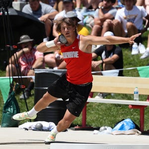 Norwayne's Dillon Morlock winds up for his record-setting throw to win the shot put and earn a state title in Div. III.