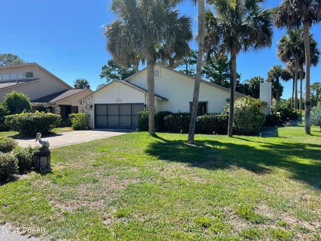 This lovely two-bedroom, two-bath waterfront home is in Pelican Bay, a sought-after, guarded and gated golf-course community in Daytona Beach.