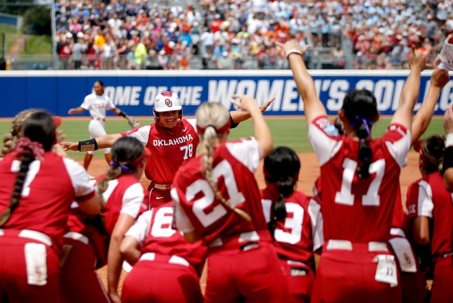 OU's Jocelyn Alo (78) celebrates a home run with teammates in the first inning of a 7-2 win over Texas on Saturday.