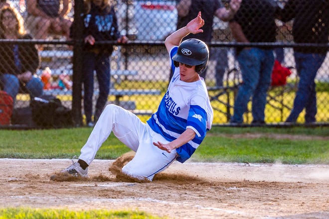 Fairhaven's Nate Grace slides safely into home plate.