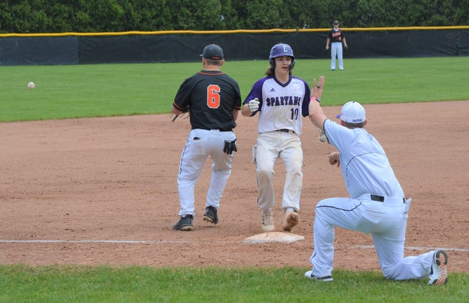 With eyes on his head coach Kyle Kracht, Lakeview's Zach Kucharczyk cruises into third base after a leadoff triple in the Spartans' win over Jackson in the district semifinals on Saturday. Lakeview will compete in a regional semifinal at Coldwater on Wednesday.