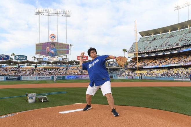 Palm Springs resident Denise Goolsby throws out the ceremonial first pitch Thursday night at Dodger Stadium.