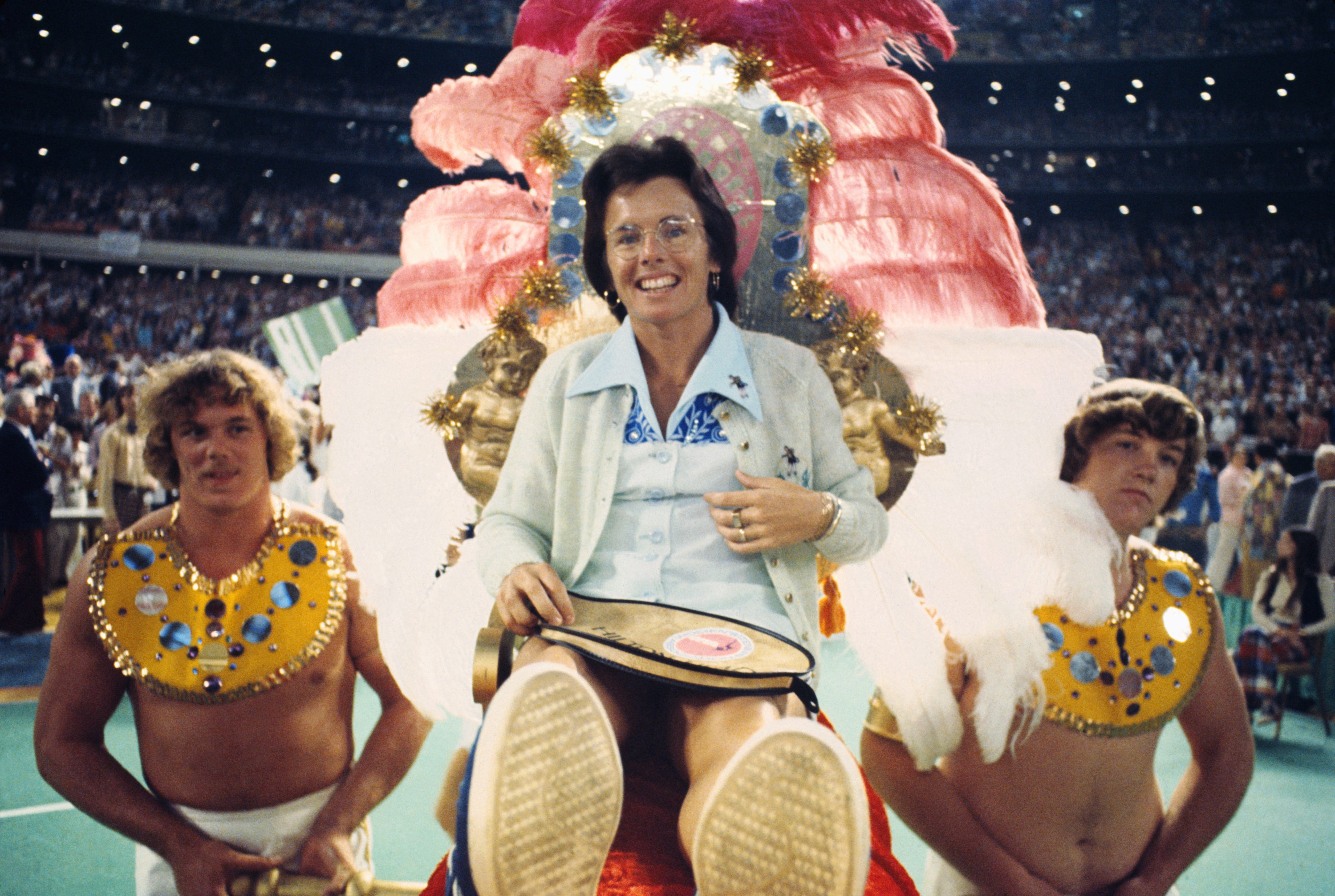 Tennis star Billie Jean King is carried to the court by four men for the battle of the sexes tennis match with 55-year-old aging tennis star Bobby Riggs on September 20, 1973.