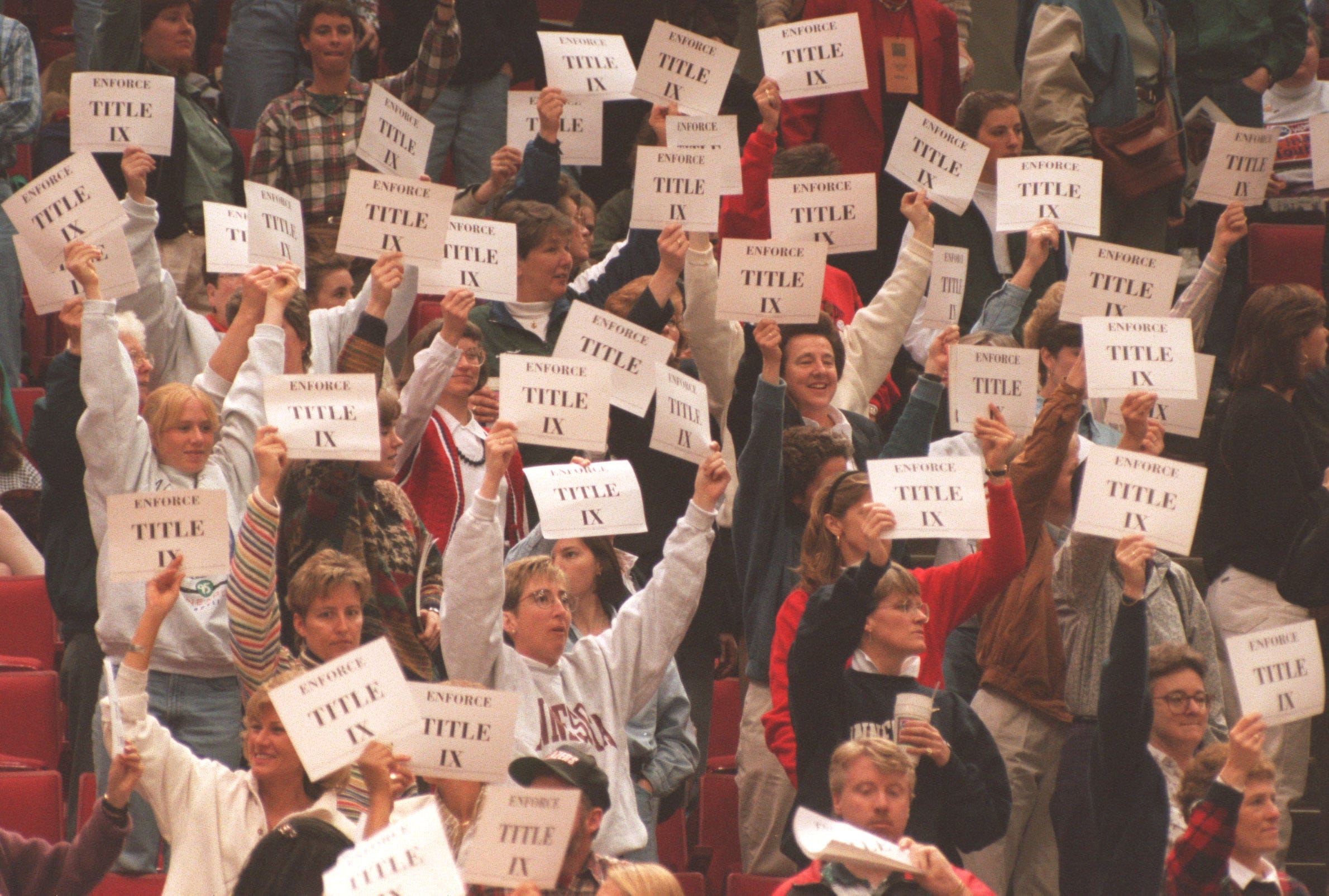 Members and supporters of the Women's Basketball Coaches Association demonstrated several times during the two semifinal games of the Women's Final Four at Target Center in Minneapolis in support of Title IX by holding up signs in the stands on April 1, 1995.