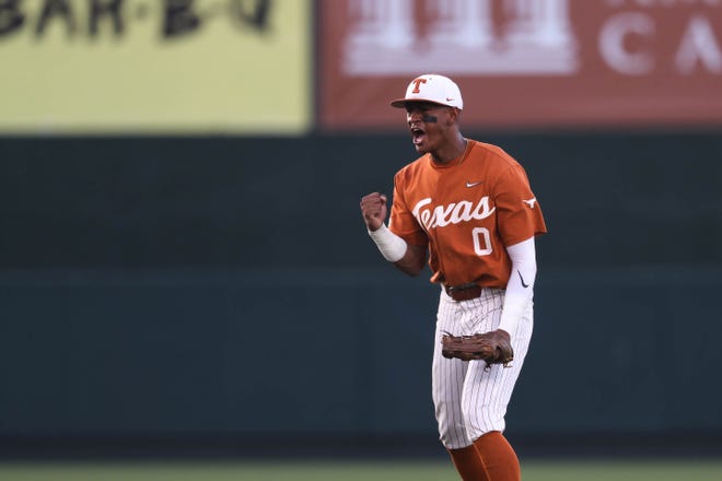 Texas infielder Trey Faltine (0) celebrates a strikeout while running back to the dugout during the NCAA regional playoff game against Louisiana Tech at Disch-Falk Field in Austin, Texas on June 4, 2022.