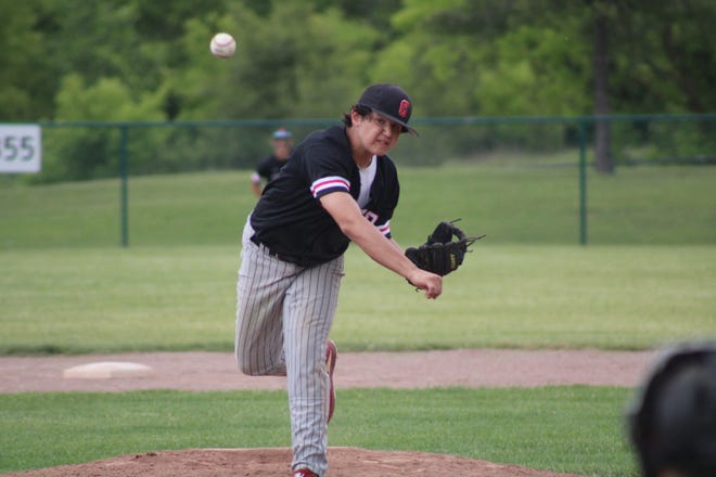 Clinton's Jalen Stelzer throws a pitch during Saturday's Division 3 district championship game at Manchester.