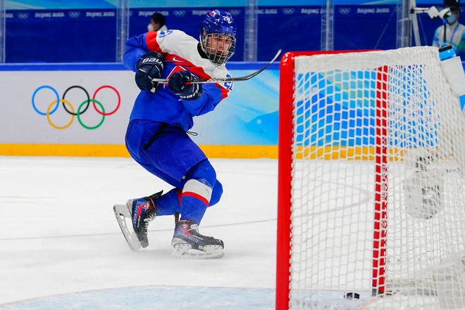 Slovakia's Juraj Slafkovsky scores an empty net goal against Sweden during the men's bronze medal game at the 2022 Winter Olympics in Beijing.