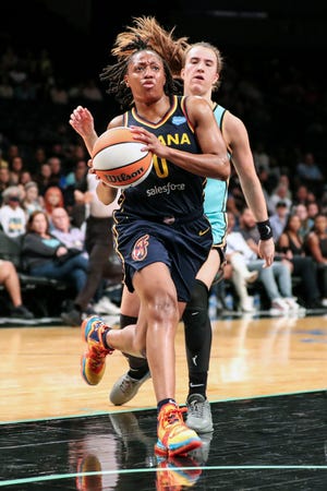 Jun 1, 2022; Brooklyn, New York, USA; Indiana Fever guard Kelsey Mitchell (0) drives past New York Liberty guard Sabrina Ionescu (20) in the first quarter at Barclays Center. Mandatory Credit: Wendell Cruz-USA TODAY Sports