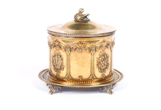 Every food you might find on a Victorian table had its own silver-plated dish. This English silver-plated jar was used for cookies or "bisquits."