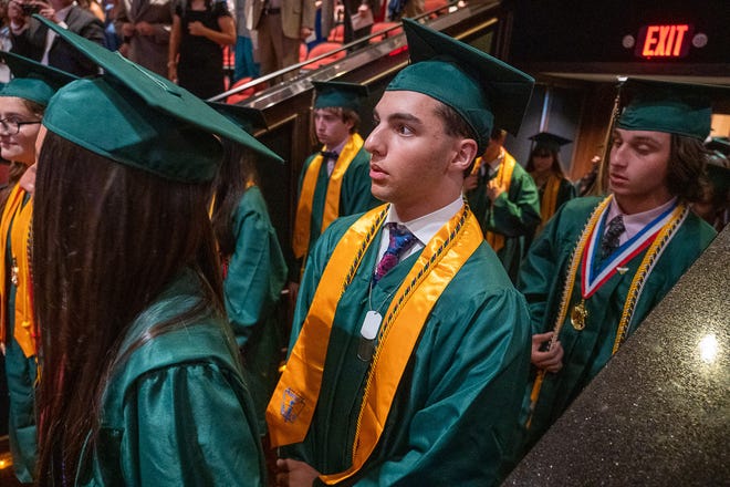 Members of the St. Joseph Academy's Class of 2022 walk into the Flagler College auditorium at the start of their commencement ceremony on Friday, June 3, 2022.