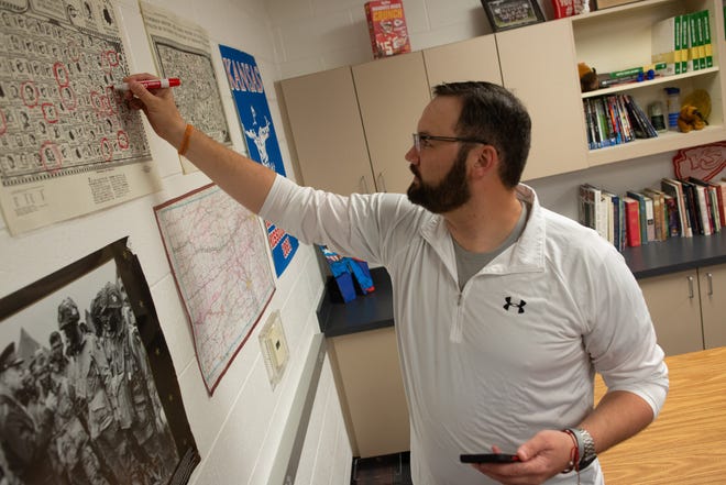 Rossville middle school social studies teacher Kraig Westhoff circles Lyon County on a map as he begins another TikTok video highlighting the origin of the Kansas county name.