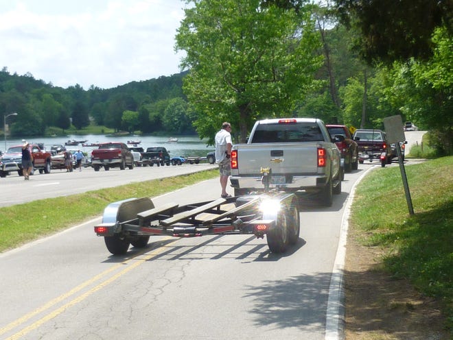 Fishermen wait in line at the crowded Clark Center ramp on Melton Hill Lake, ready to load their boats at the conclusion of a bass tournament on Saturday, May 21.