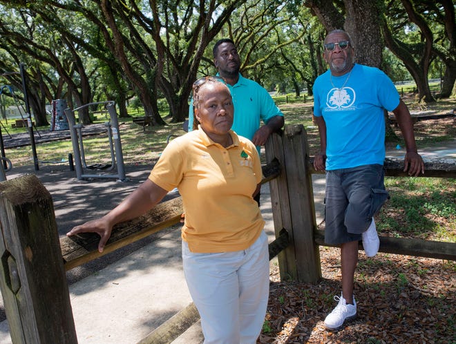 From left, Cantonment Improvement Committee members Finna Clay, TJ Lee and Josh Womack stand for a photo Monday. The Cantonment Improvement Committee is celebrating 10 years of serving the area.