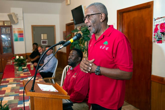 Cantonment Improvement Committee member Josh Womack discusses the organization's successes during a celebration of its 10-year anniversary on Friday.