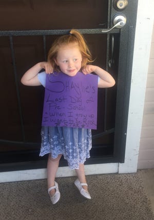 Shaylie Edwards holds up a sign announcing she wants to be a rock star just hours before she was hit by a car in 2019.