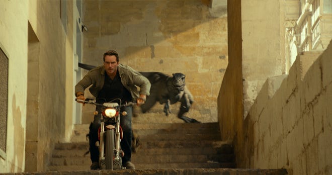Owen Grady (Chris Pratt) gets chased by a speedy and very deadly Atrociraptor in "Jurassic World Dominion."