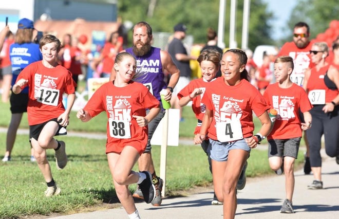 Runners take off during the first annual Charlie Brewer Memorial Fun Run on Aug. 14, 2021, in Woodward.