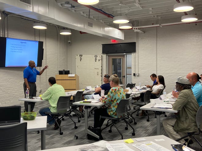 Myron Pullum engages with veterans at the Boots to Business Reboot training held at The Bakery District's University of Arkansas at Fort Smith classrooms.