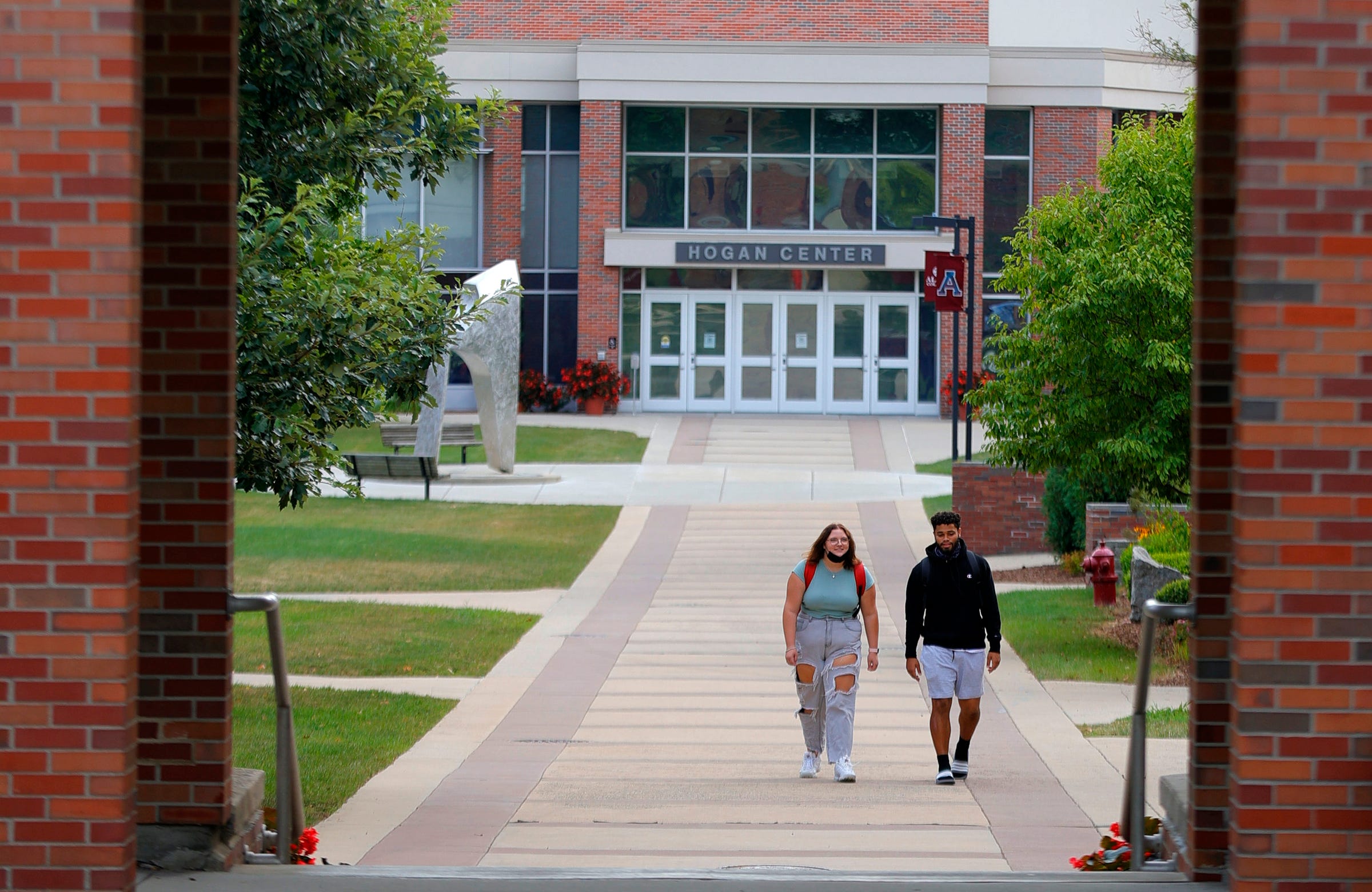 Students head to class at Alma College in Alma on Tuesday, Aug. 31, 2021.