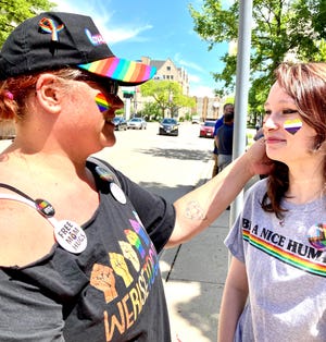 Amy DeBraske, left, came to the city of Green Bay Pride flag-raising event on Tuesday, June 7, 2022, donned in all things rainbow to support her daughter Piper, right, who identifies as a member of the LGBTQ community.