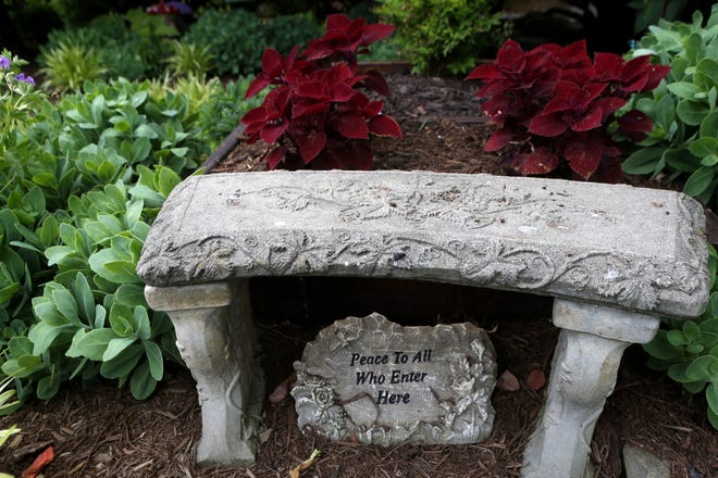 A seat in Lisa and Glenn Todd's garden.  May 25, 2022
