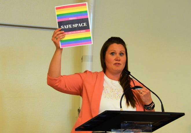 Lead-Deadwood Elementary School counselor Amanda Bender holds up a “Safe Space” sign during a recent school board meeting. The sign led to a proposed policy in the Lead-Deadwood schools that would regulate how teachers can decorate or adorn their classrooms.