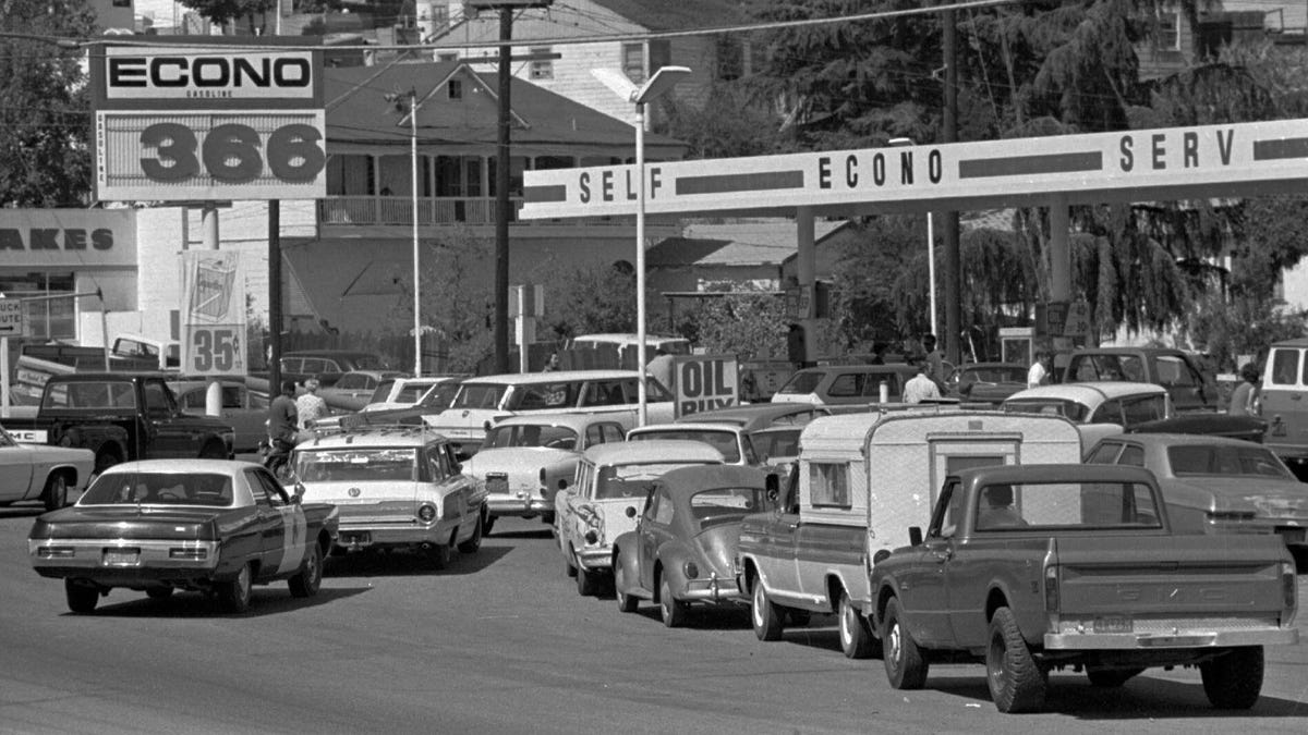 FILE - Cars line up for gas at a gas station in Martinez, Calif., on Sept. 21, 1973. An unhappy confluence of events has economists reaching back to the days of disco and the bleak high-inflation, high-unemployment economy of nearly a half century ago. No one thinks stagflation is in sight. But as a longer-term threat, it can no longer be dismissed.(AP Photo/File) ORG XMIT: NYSB333