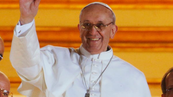 March 13, 2013: Pope Francis waves to the crowd fr