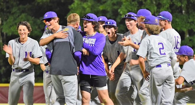 Head coach Eric Wells celebrates with members of the Marshwood High School baseball team after Tuesday's upset at No. 5 Gorham in a Class A South first-round game.