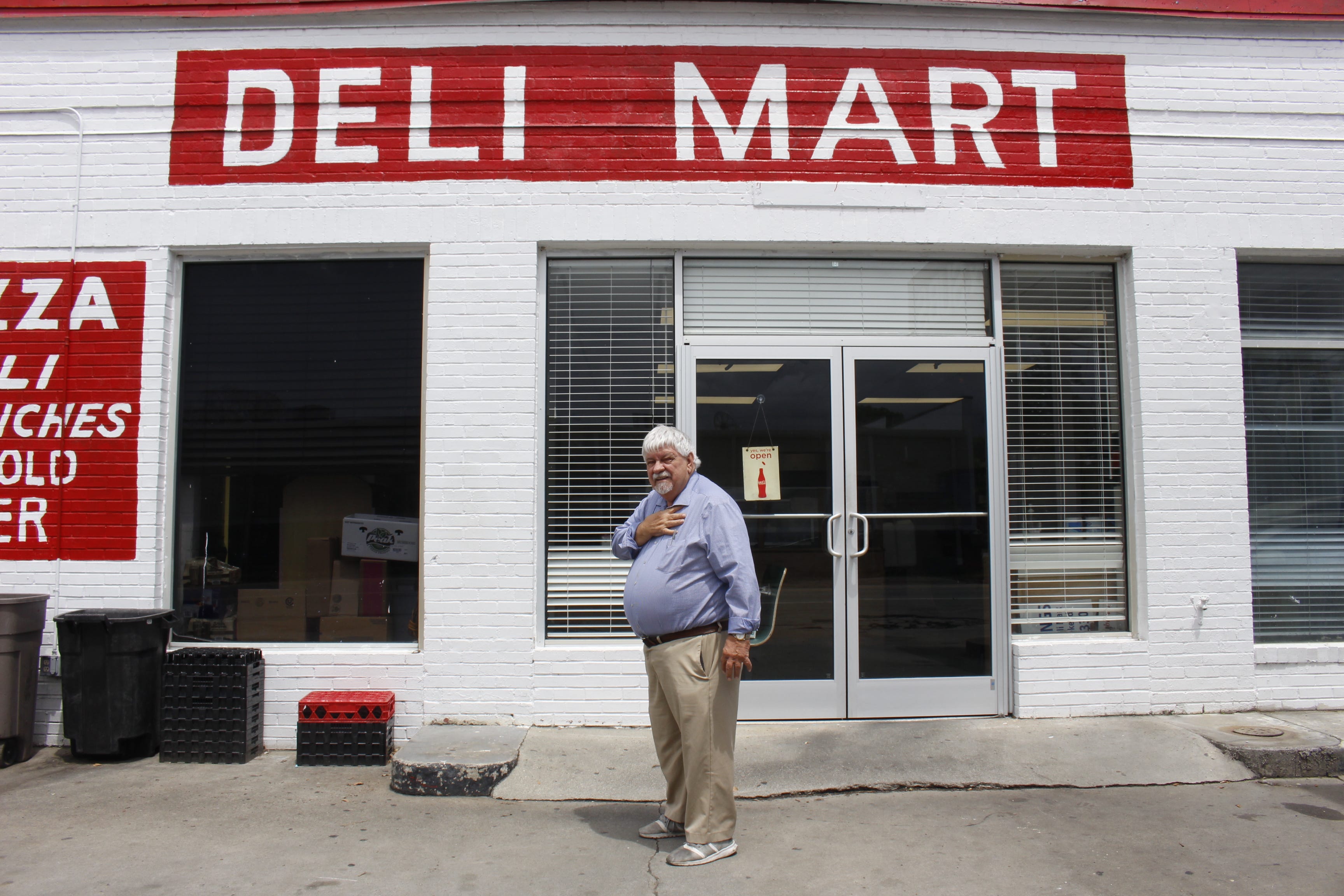Tim Holbrook, former mayor of Port Wentworth elected in 2001, stands in front of his shop, the Deli Mart, one of the locally owned restaurants in downtown Port Wentworth.
