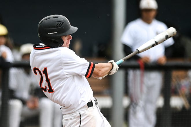Brighton's Nick Baker drives in a run against Holt in the seventh inning on Wednesday, June 8, 2022, in East Lansing.