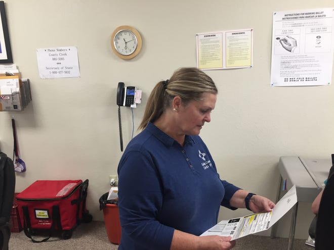 Eddy County Clerk Darlene Rosprim checks last minute voter information at the Eddy County Clerk's Office in Carlsbad on June 7, 2022.