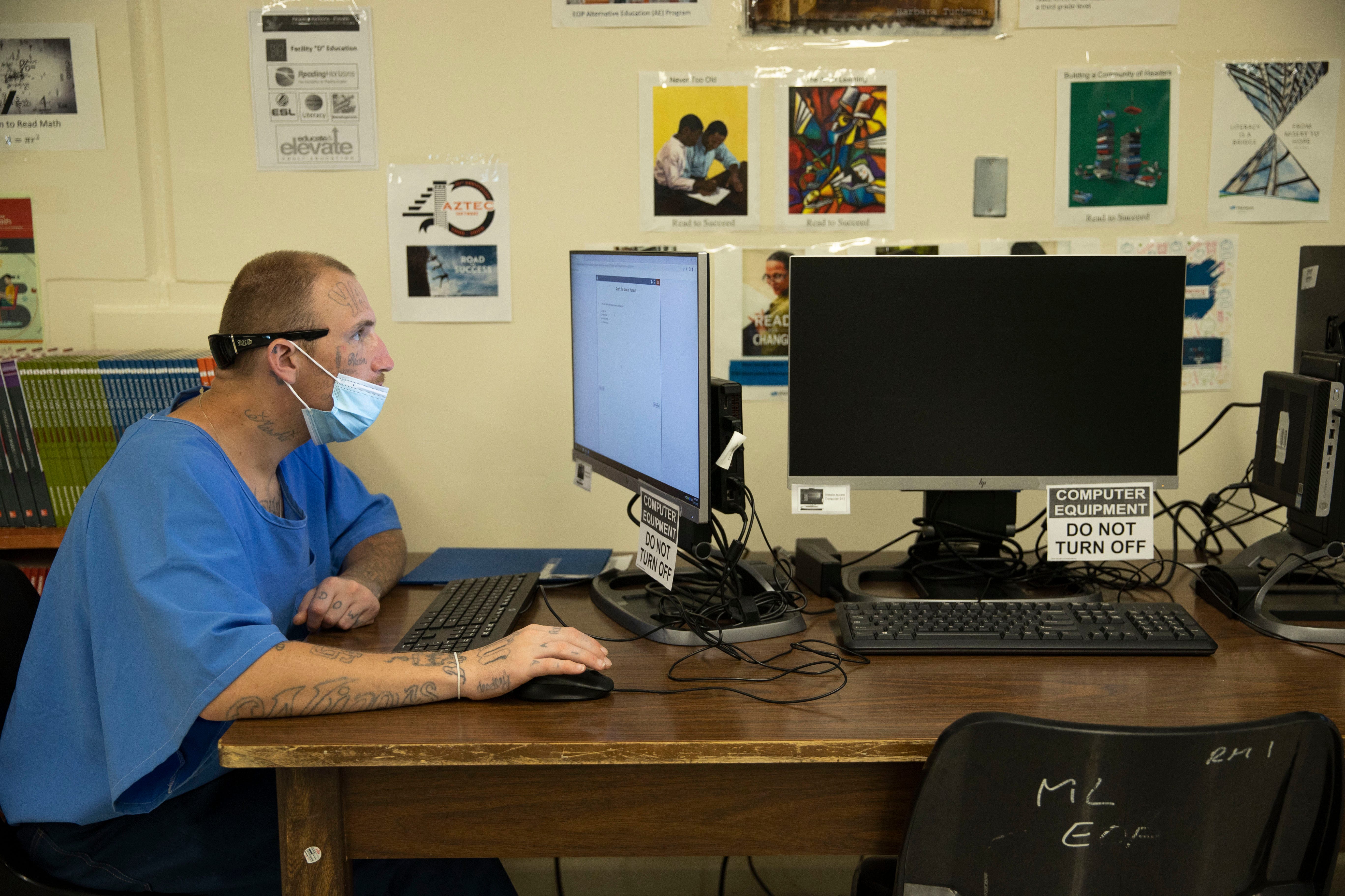 Daniel Taylor works on assignments at Los Angeles County State Prison in Lancaster, California, in May.