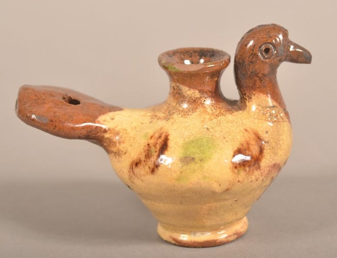 People have made ceramic whistles shaped like birds for hundreds of years. This one is a piece of American redware made in the 1800s.